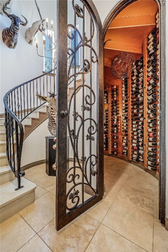 Wine room featuring tile patterned floors and baseboards | Image 11