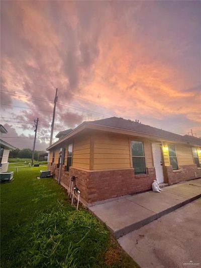 View of front of home featuring a patio area and a lawn | Image 2