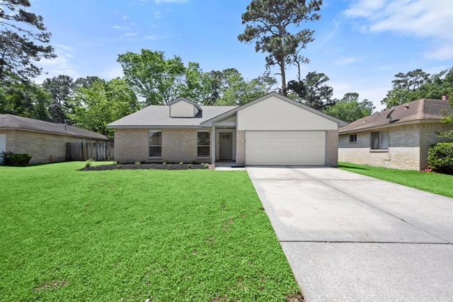 Welcome to 17311 Lowick St – A beautifully refreshed home nestled in the Memorial Chase community, offering charming curb appeal with power-washed exterior, a brand-new front door, and fresh landscaping. | Image 8