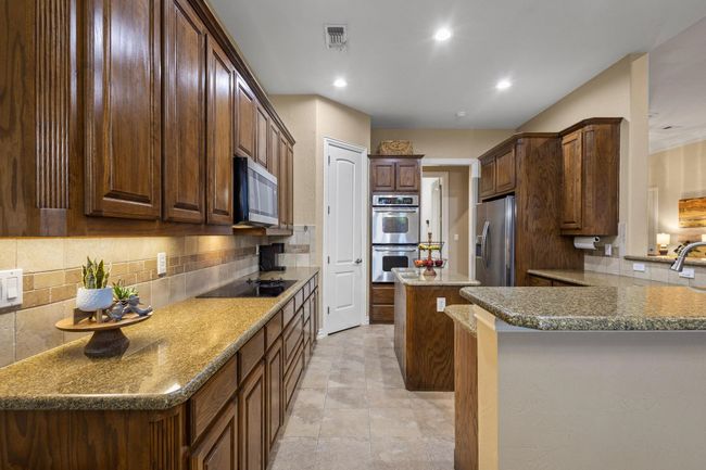Beautiful real wood cabinets and recessed lighting. | Image 17
