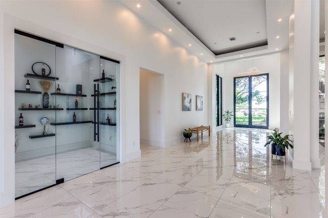 Gallery entryway with wine room | Image 6