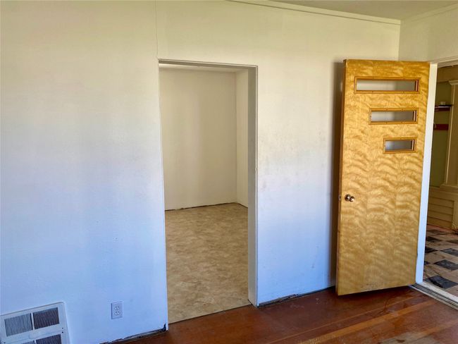 Living room facing front entrance and 2nd bedroom | Image 6