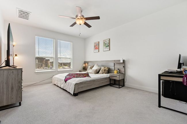 Bedroom with carpet floors and a ceiling fan | Image 14