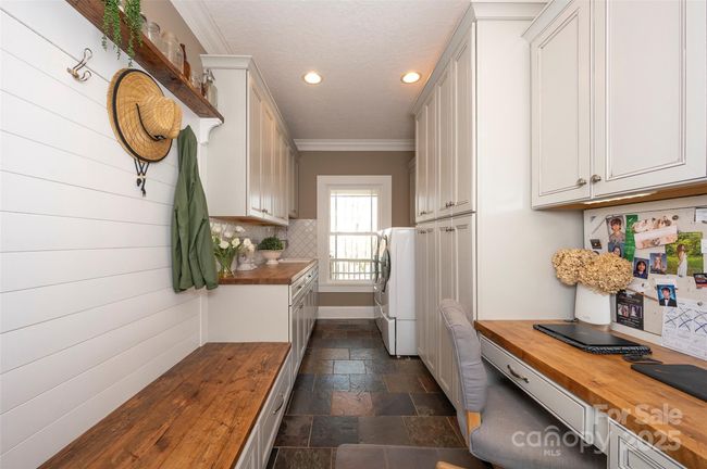 Main Level Laundry Room with Built-in Desk | Image 15