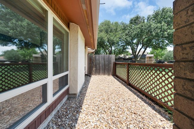 Large, easy care fenced patio extension - this is the only grounds which are to be owner-maintained. HOA handles front yard maintenance | Image 22