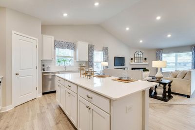 Gorgeous kitchen with large center island and nice pantry for storage. Photo of Model Home. Options and colors may vary. | Image 3