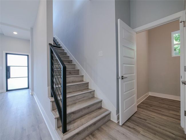 Stairs featuring wood finished floors and recessed lighting | Image 14