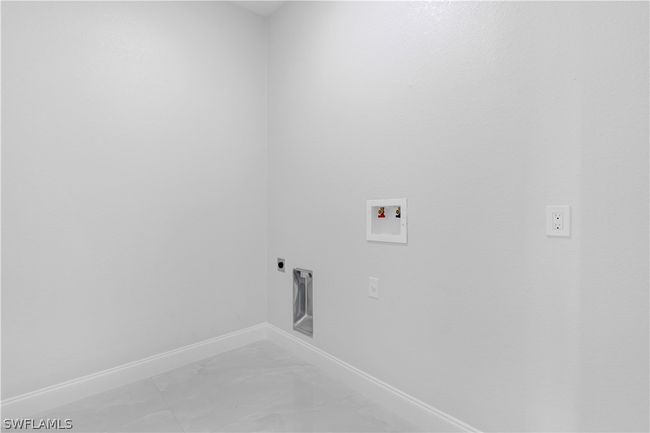 Laundry room with electric dryer hookup, washer hookup, and tile floors | Image 24