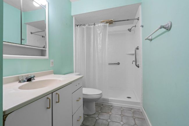 Three fourth bathroom conveniently located to serve all main-floor bedrooms and guests. | Image 9