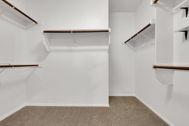 Walk in closet featuring carpet floors | Image 21