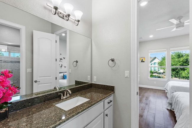 Ensuite bathroom featuring vanity, wood flooring, and ceiling fan | Image 28