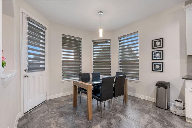 Bright dining area ideal for cozy meals and gatherings. | Image 18