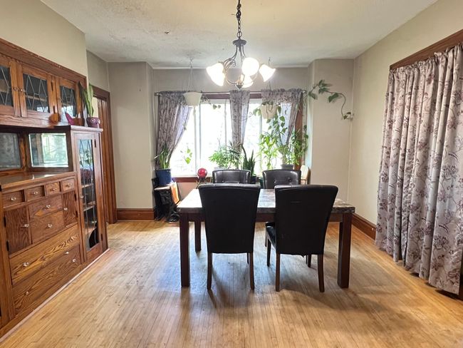 Dining room featuring hardwood floors and built in hutch. | Image 8