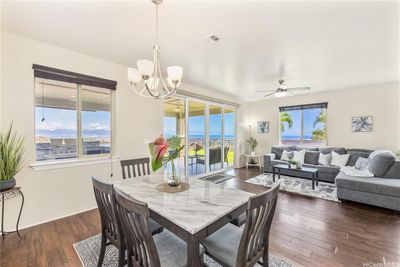 Sit and enjoy the sunrise and sunset views while at the dining table or sitting on the couch or on your patio lanai! | Image 1