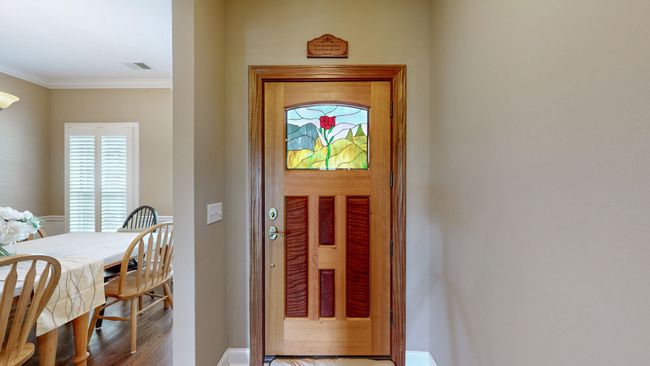 The gorgeous custom front door welcomes you upon arrival and sets this home apart from its neighbors. | Image 4