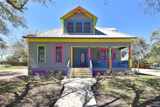 Come on up the Austin Limestone steps onto the covered front porch. Notice the metal roof. No worrying that the insurance company will deny coverage because of an over-5-year-old-roof! | Image 6