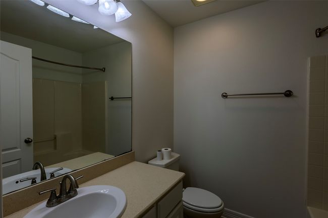 Bathroom featuring toilet and vanity | Image 27