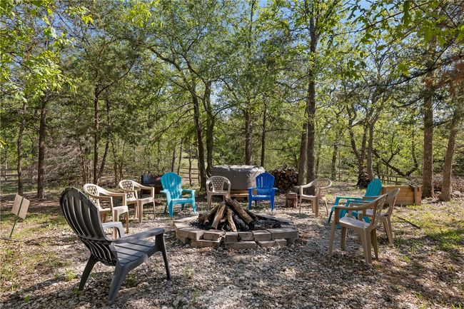 View of yard with a fire pit | Image 17