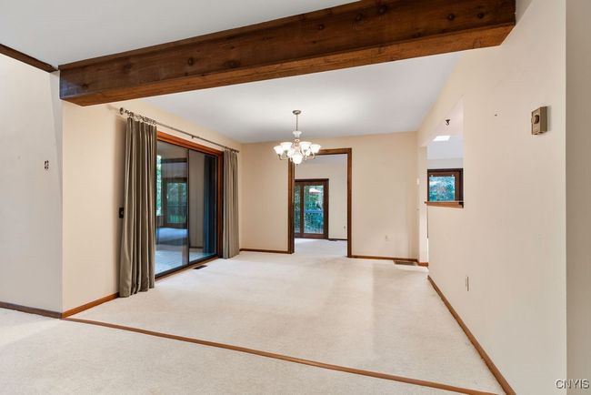 Just off the dining room is a covered deck! | Image 10