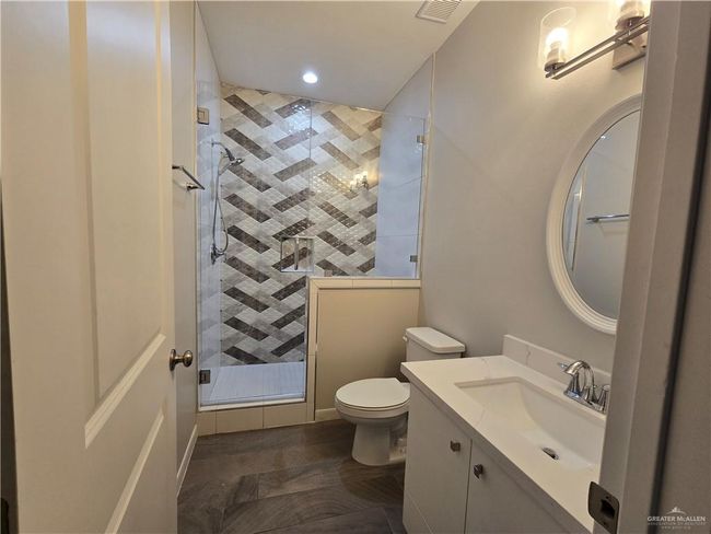 Bathroom with vanity, toilet, a shower stall, and recessed lighting | Image 16