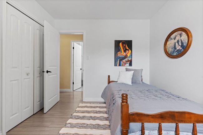 Bedroom with light wood-style floors and a closet | Image 19