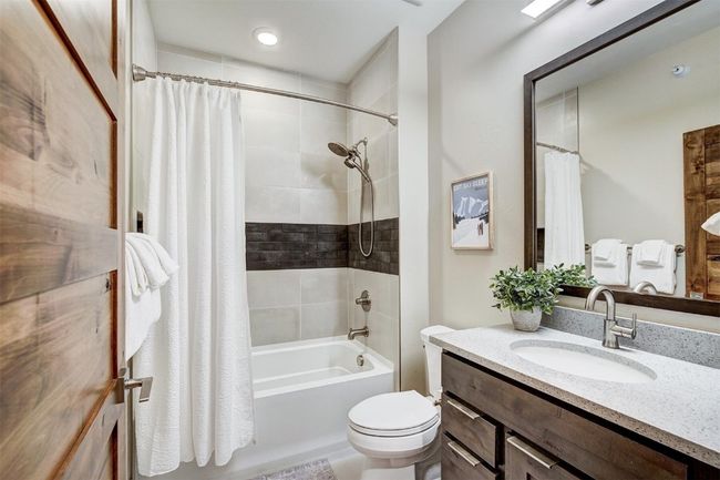 Full bathroom with shower / tub combo, vanity, and toilet | Image 30