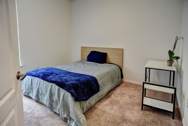 View of carpeted bedroom | Image 28