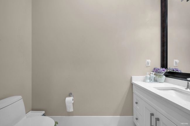 Bathroom featuring toilet and vanity | Image 21
