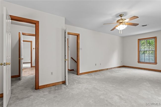 Carpeted spare room with a ceiling fan and baseboards | Image 19