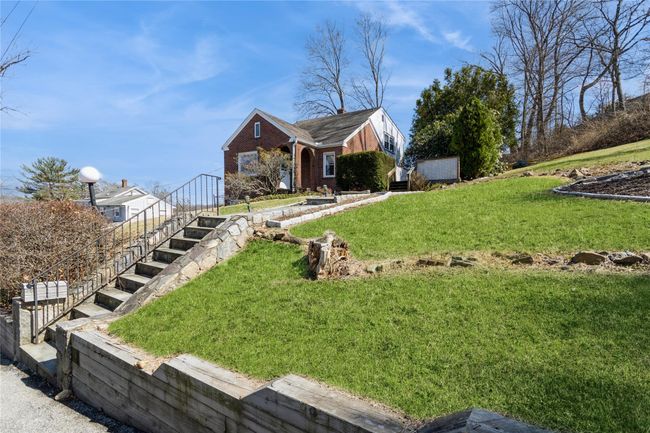 Front steps and lawn leading to the house. | Image 22