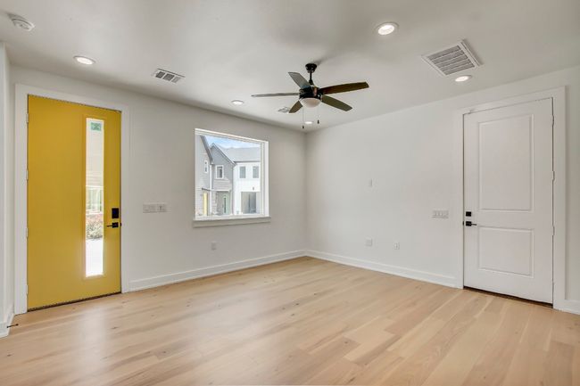 Foyer entrance with light wood-type flooring, recessed lighting, a ceiling fan, and baseboards | Image 8
