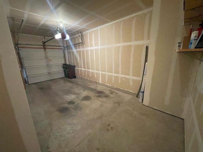 Garage with a garage door opener | Image 15