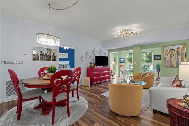 Lovely open floorplan which creates a bright and cheerful atmosphere! The luxury vinyl flooring is on-trend and easy to care for, too. | Image 9