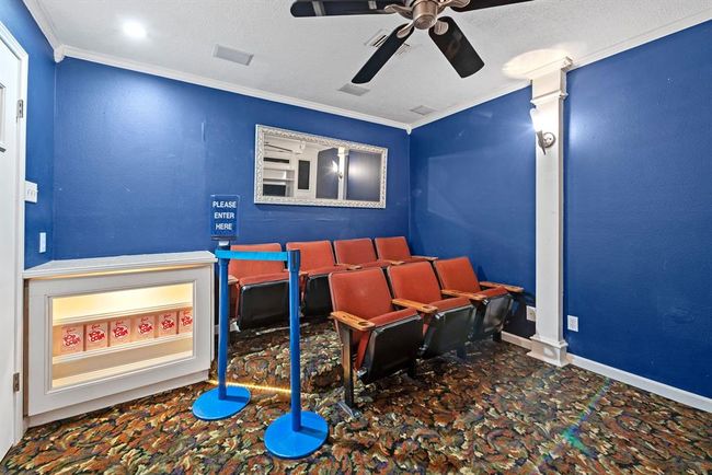 One upstairs bedroom has been used as a media room complete with refreshment serving area. | Image 30