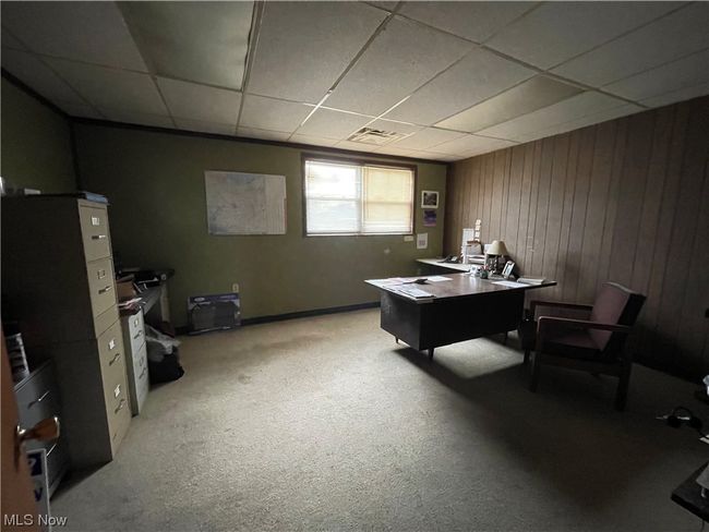 Office with a paneled ceiling and light colored carpet | Image 14