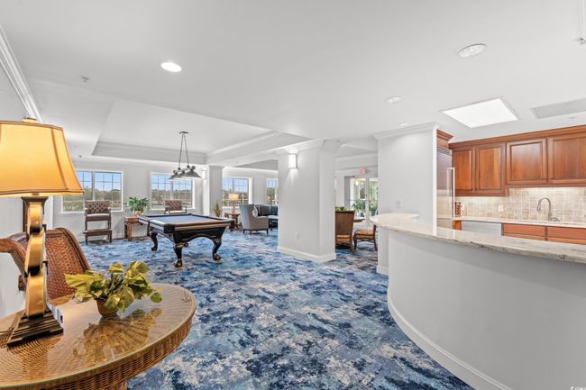 Recreation room featuring carpet flooring, billiards table, recessed lighting, crown molding, and a raised ceiling | Image 33