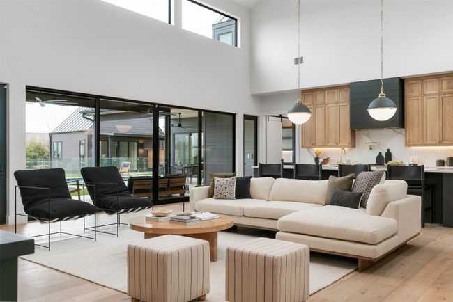 The living room is a masterpiece of warmth and elegance, centered around a fireplace | Image 6