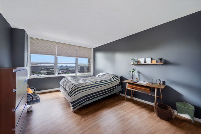 Bedroom with grey paint and carpet removed. | Image 10