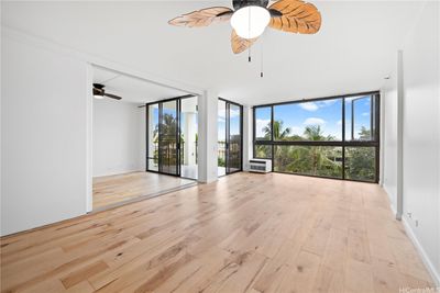 Living area and open second bedroom open up the the lanai. | Image 2