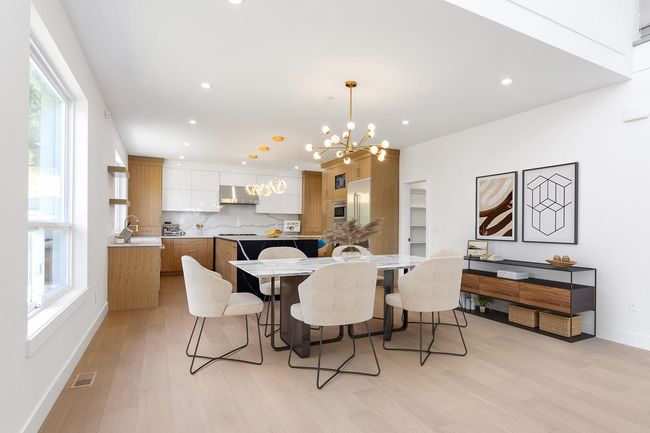 Dining room featuring baseboards, visible vents, light wood-style flooring, recessed lighting, and a notable chandelier | Image 8