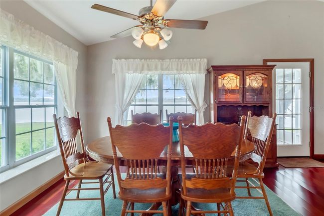 Formal Dining Area with Panoramic Water Views | Image 13