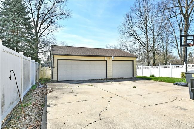 Detached garage featuring fence | Image 6