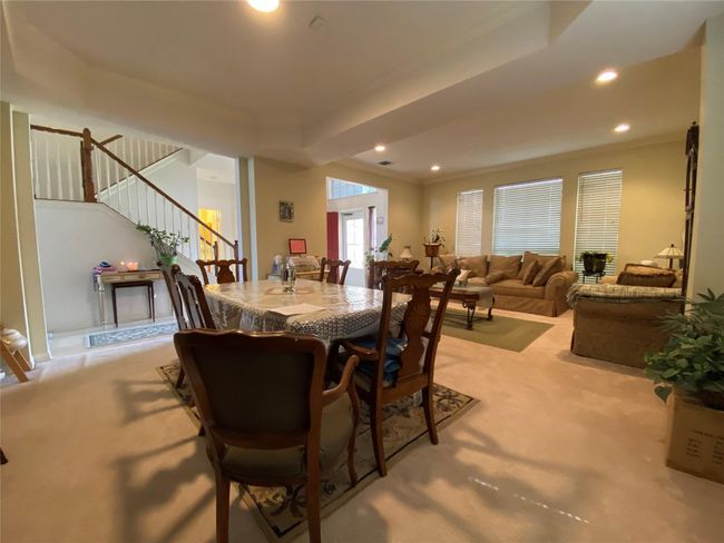 Carpeted dining room featuring ornamental molding | Image 18