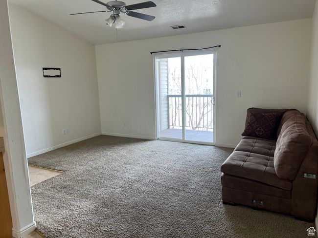 Unfurnished room featuring a ceiling fan and carpet | Image 7