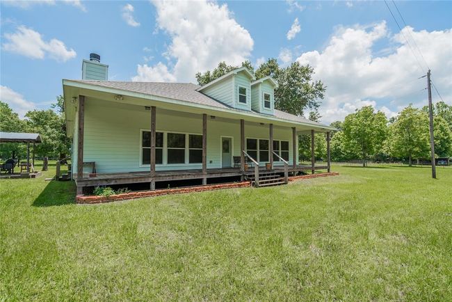 Some other information about the home is that it has 10' ceilings, central air/heat, ceiling fans, and a security system in place. Ceiling beams in the Living Room and Dining Room are decorative, but are made of 6" x 6" Red Oak. | Image 4