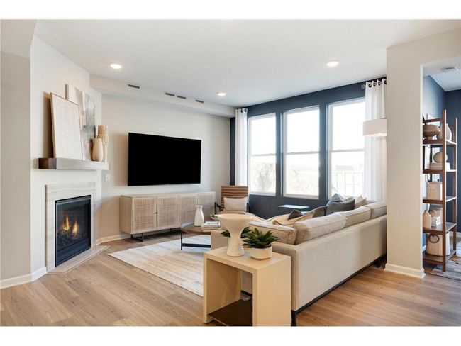 The Ashton living room has more than enough leg room for any furniture configuration you may want! Photo of model home. | Image 28
