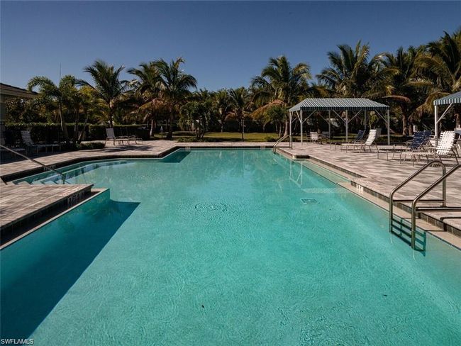 View of swimming pool featuring a patio area and a gazebo | Image 23