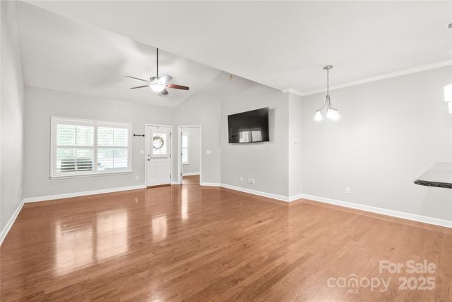 Large open floorplan with vaulted ceiling in the living room. | Image 4