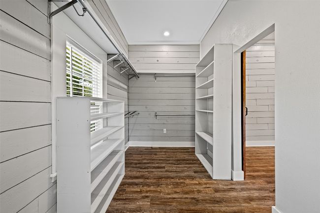 Walk in closet featuring wood finished floors | Image 19