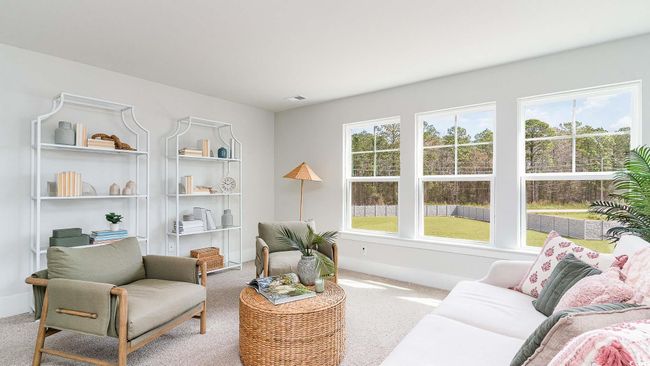 Carpeted living room featuring baseboards | Image 23